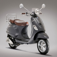 New and vintage Vespas on the road
